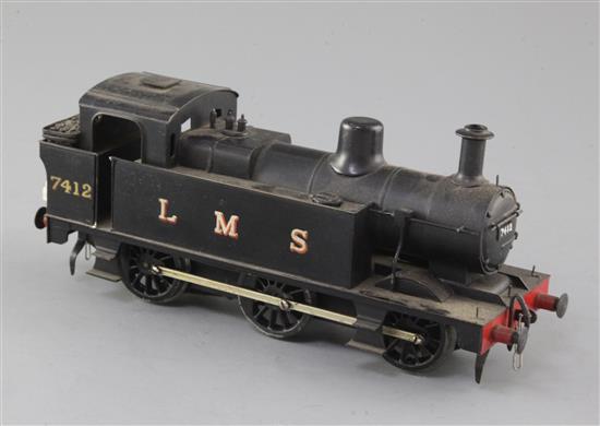 A scratch built O gauge 0-6-0 tank locomotive, number 7412, LMS black livery, 3 rail with skate, overall 22cm